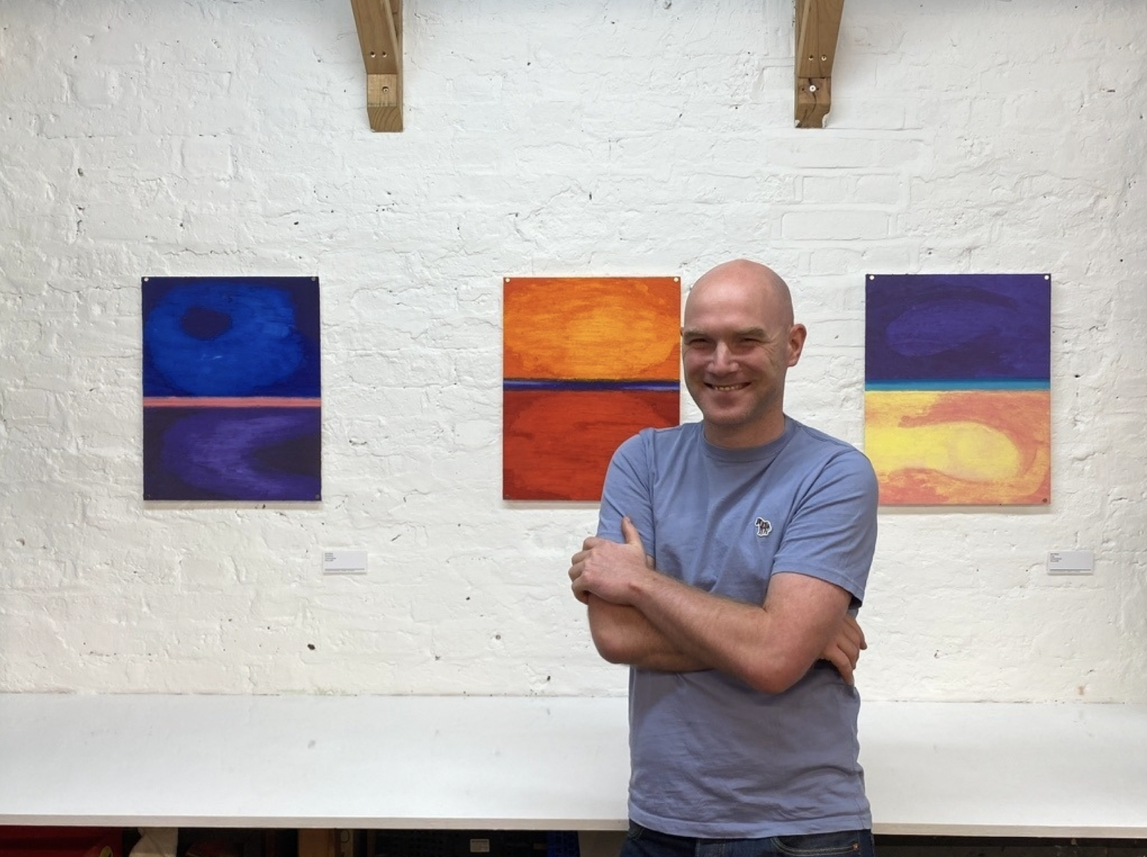 Rob White in front of his work in Periphery exhibition